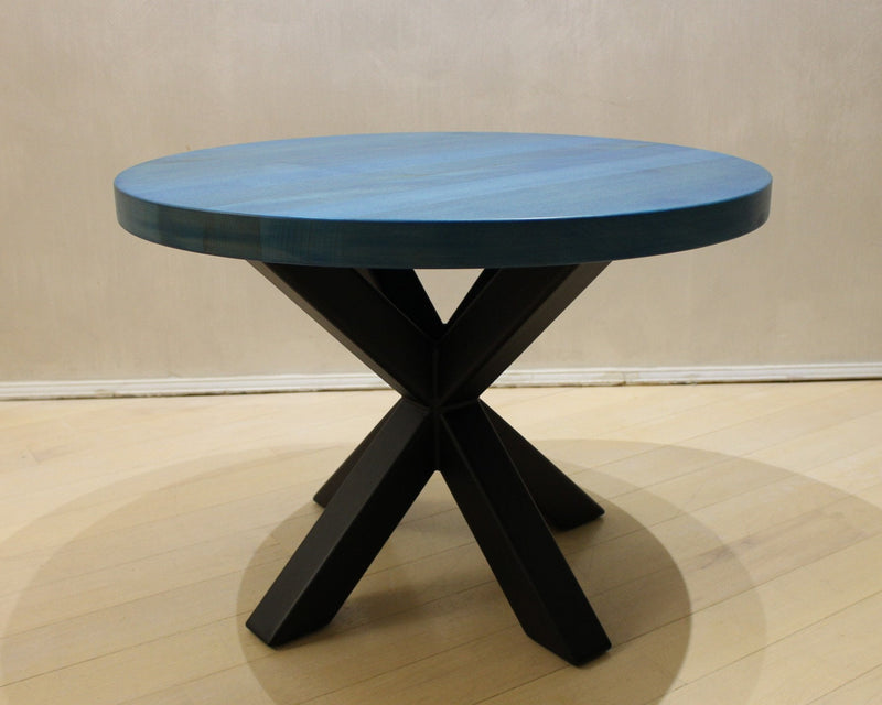 Modern round wooden table with blue lacquered top and black metal spider legs – contemporary designer coffee table