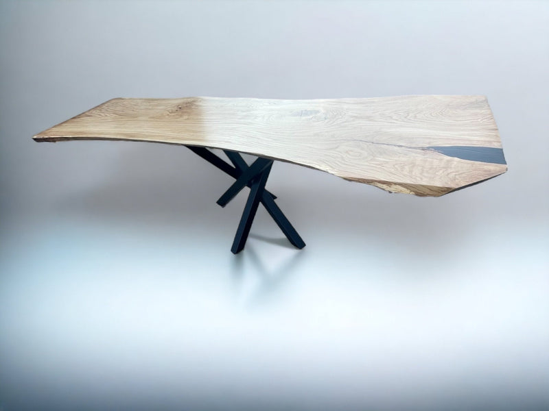 Live edge solid oak dining table crafted from a single wood slab with black metal legs – luxury monolith design