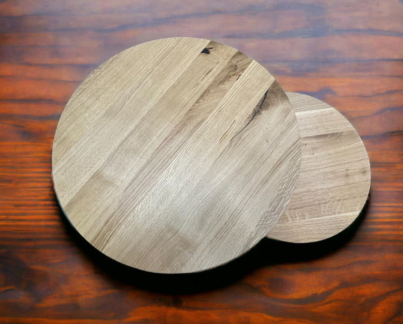Minimalist nest of two round oak tables with elegant tapered legs, perfect for modern living spaces