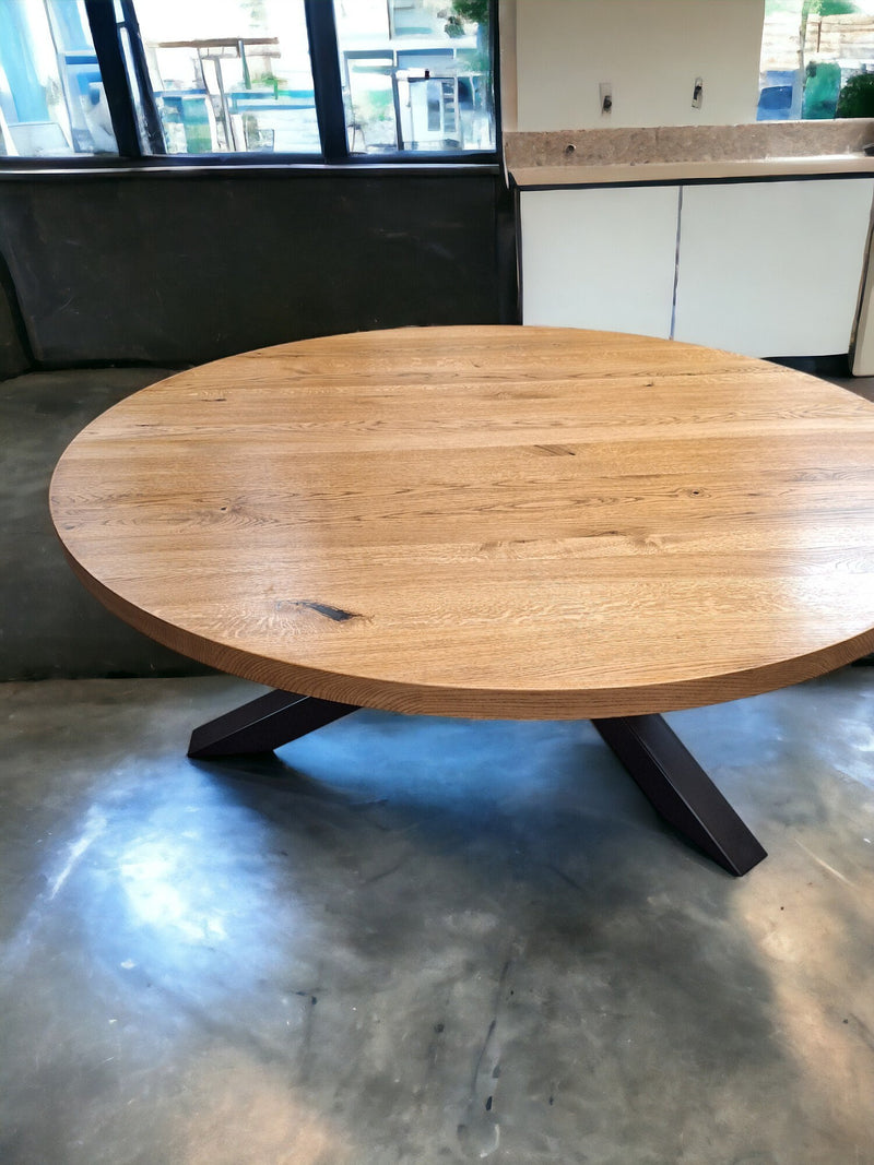 Premium round oak dining table with central pedestal metal base, perfect for contemporary dining rooms