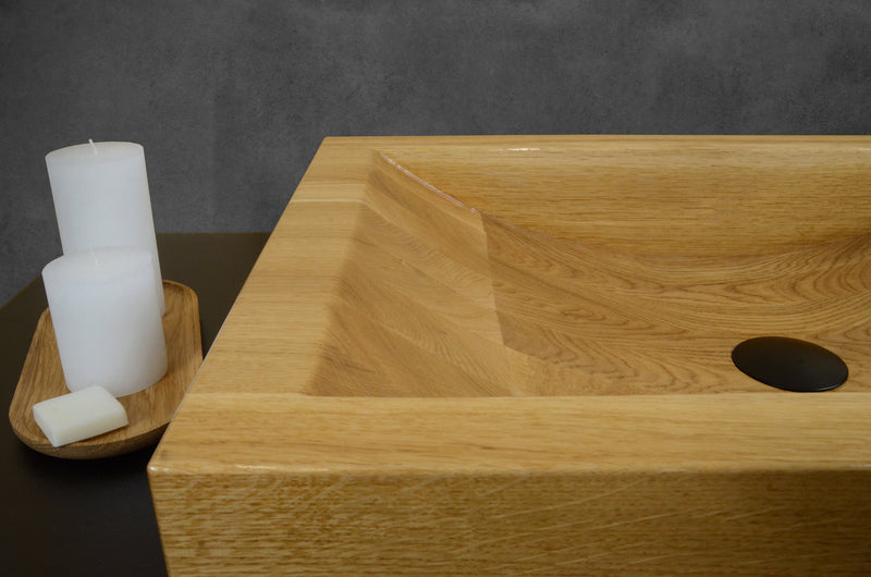 Solid oak bathroom sink with unique wood grain patterns, custom handcrafted wooden washbasin