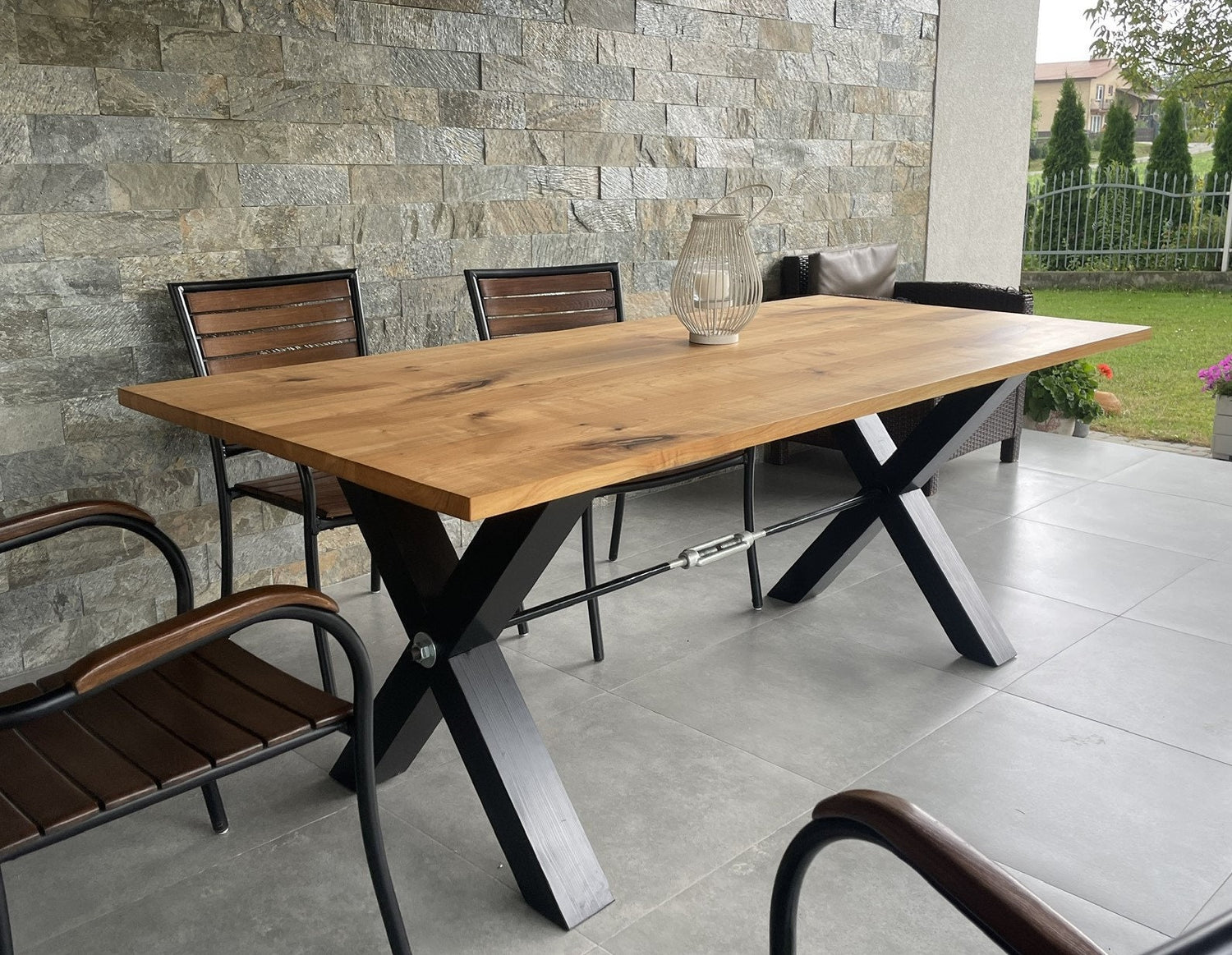Handcrafted rectangular ash wood dining table with X-shaped metal legs, modern rustic design for dining room or office