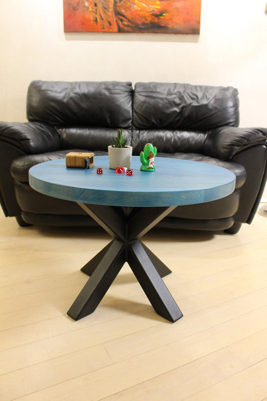 Blue Scandinavian-inspired wooden coffee table with spider-style metal base – chic and sturdy design
