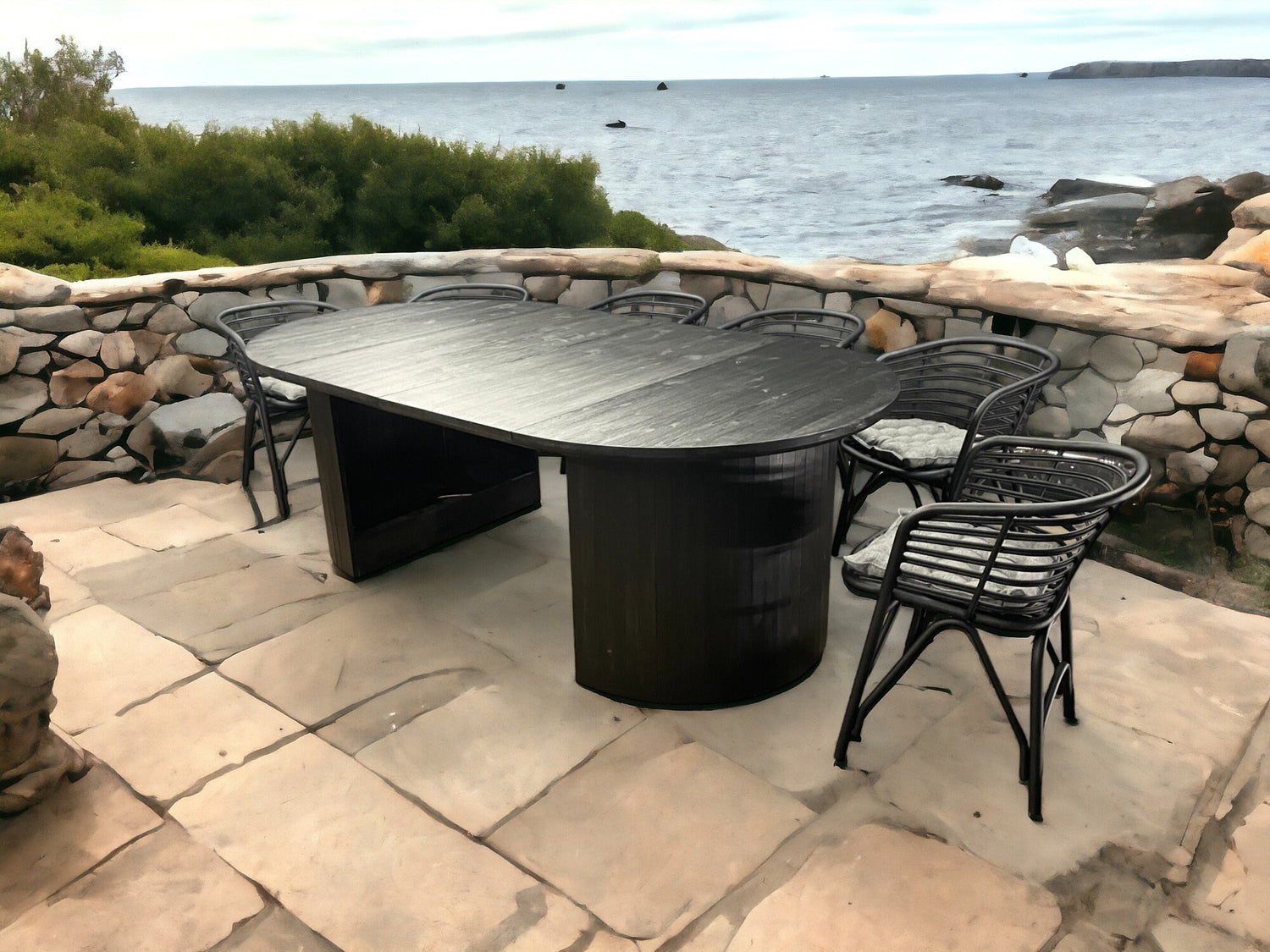 Convertible outdoor oak table with circular top and bold geometric split base, ideal for patios