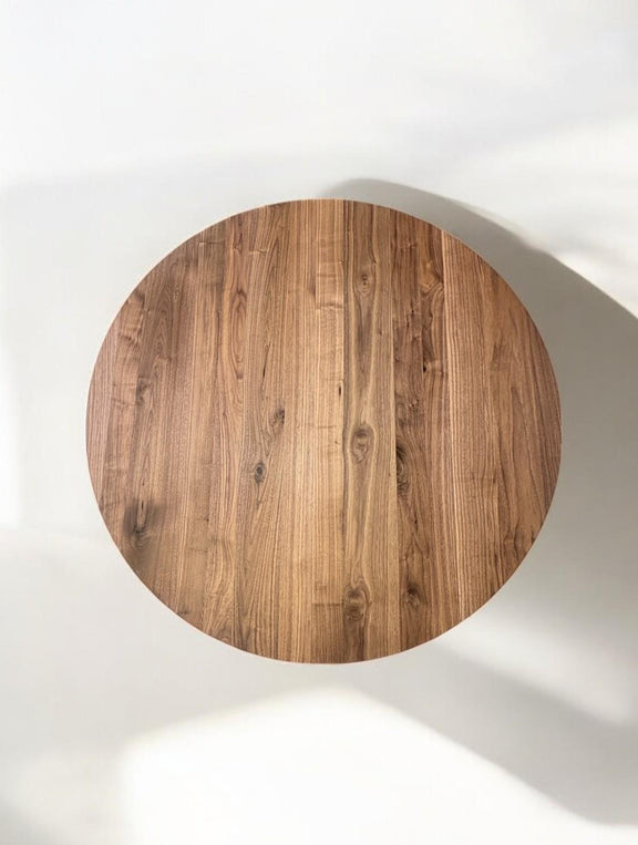 Custom-made extendable walnut round kitchen table with elegant metal pedestal legs