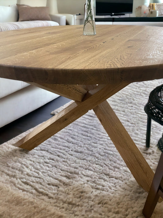 Elegant oak round dining table with artistic wooden X-shaped base – handcrafted luxury furniture