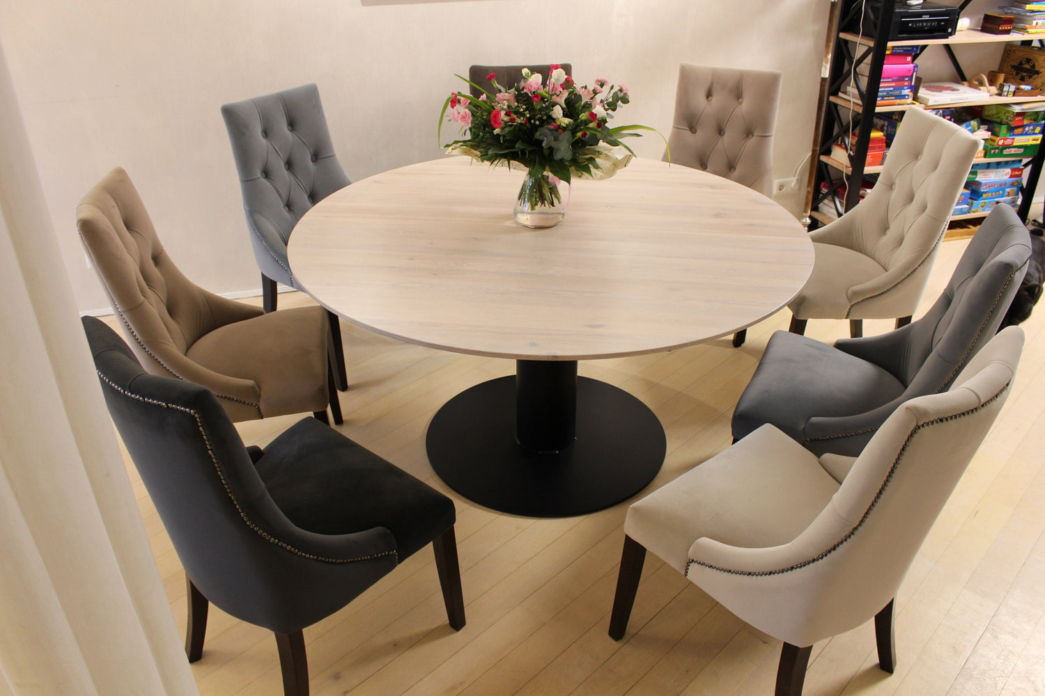 Handcrafted round oak dining table with steel pedestal base, extendable wooden kitchen table for family meals