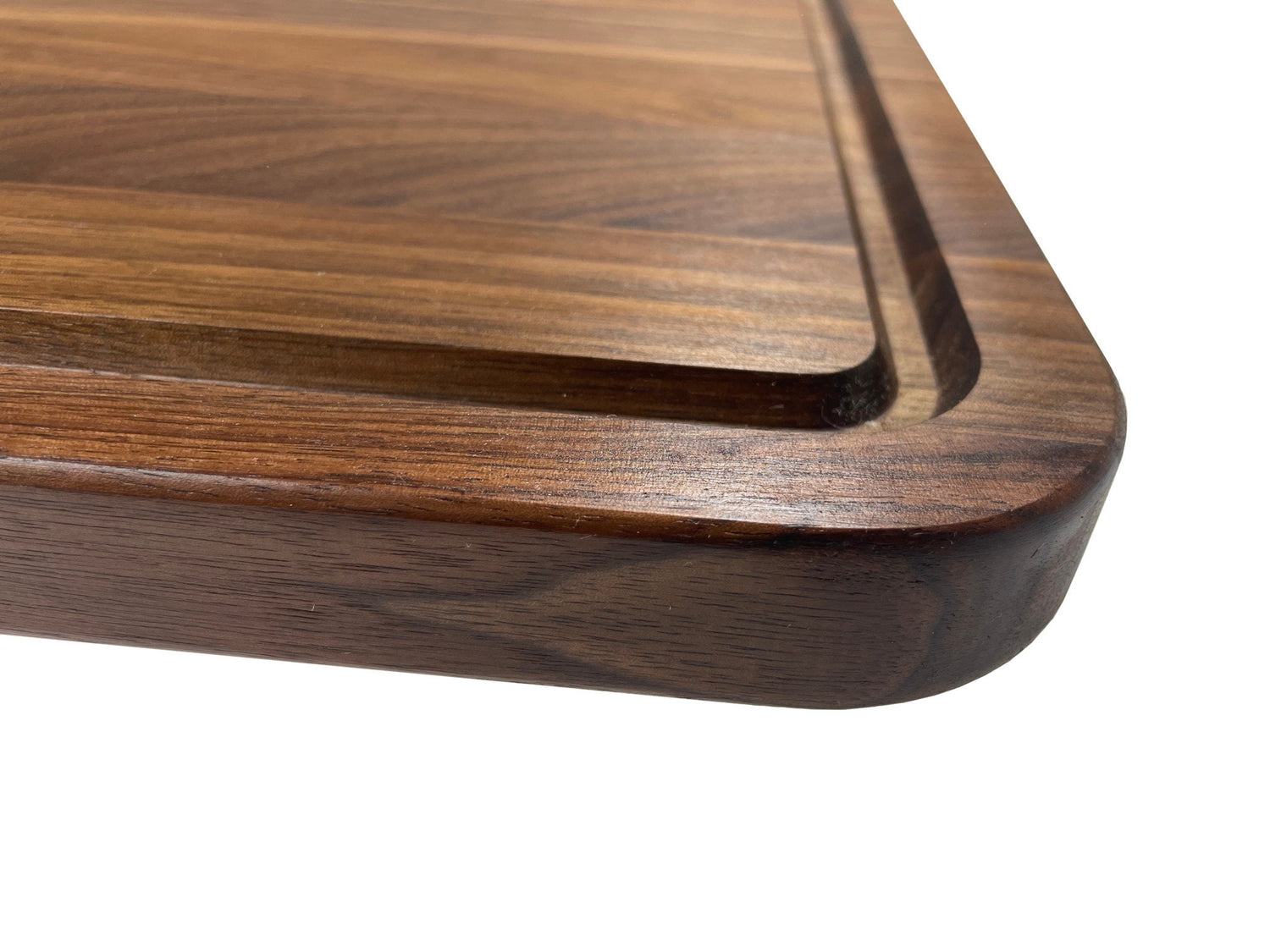 Handcrafted walnut charcuterie board with rich wood grain, perfect for cheeses, meats, and appetizers
