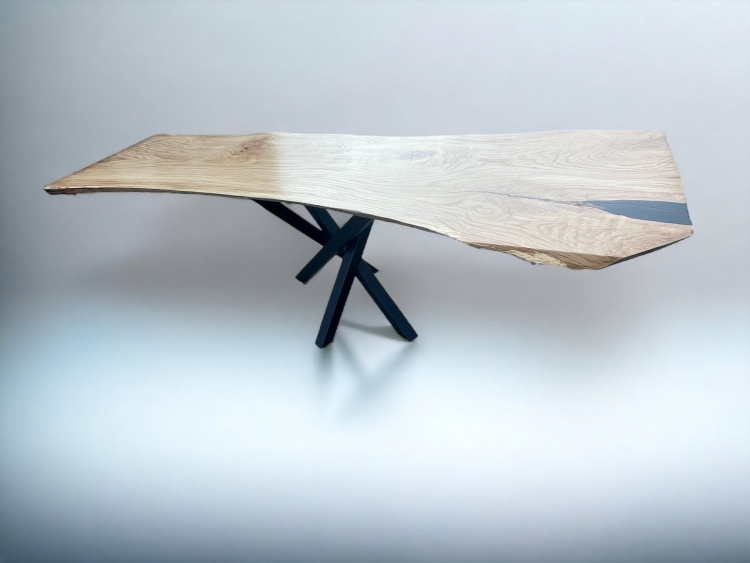 Live edge solid oak dining table crafted from a single wood slab with black metal legs – luxury monolith design