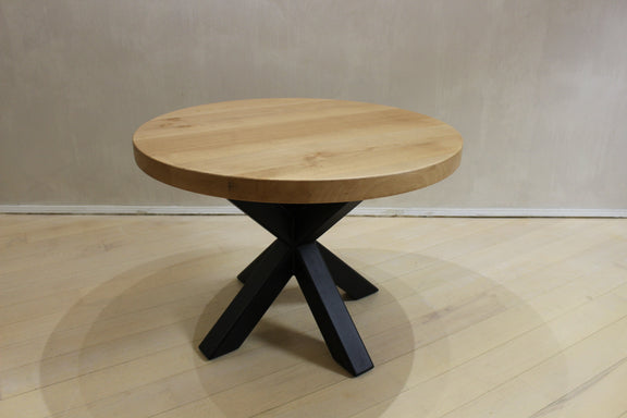 Loft-style coffee table with round oak top and spider-shaped metal legs, handcrafted designer piece