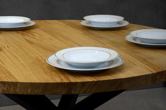 Modern oak dining table round and expandable with durable iron legs for elegant interiors