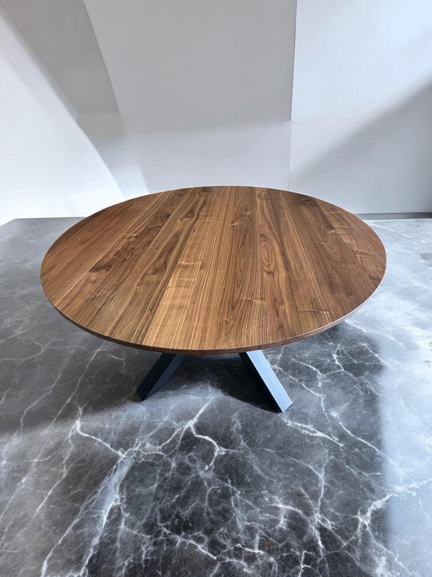 modern style expandable round dining table made of rich American walnut and powder-coated legs
