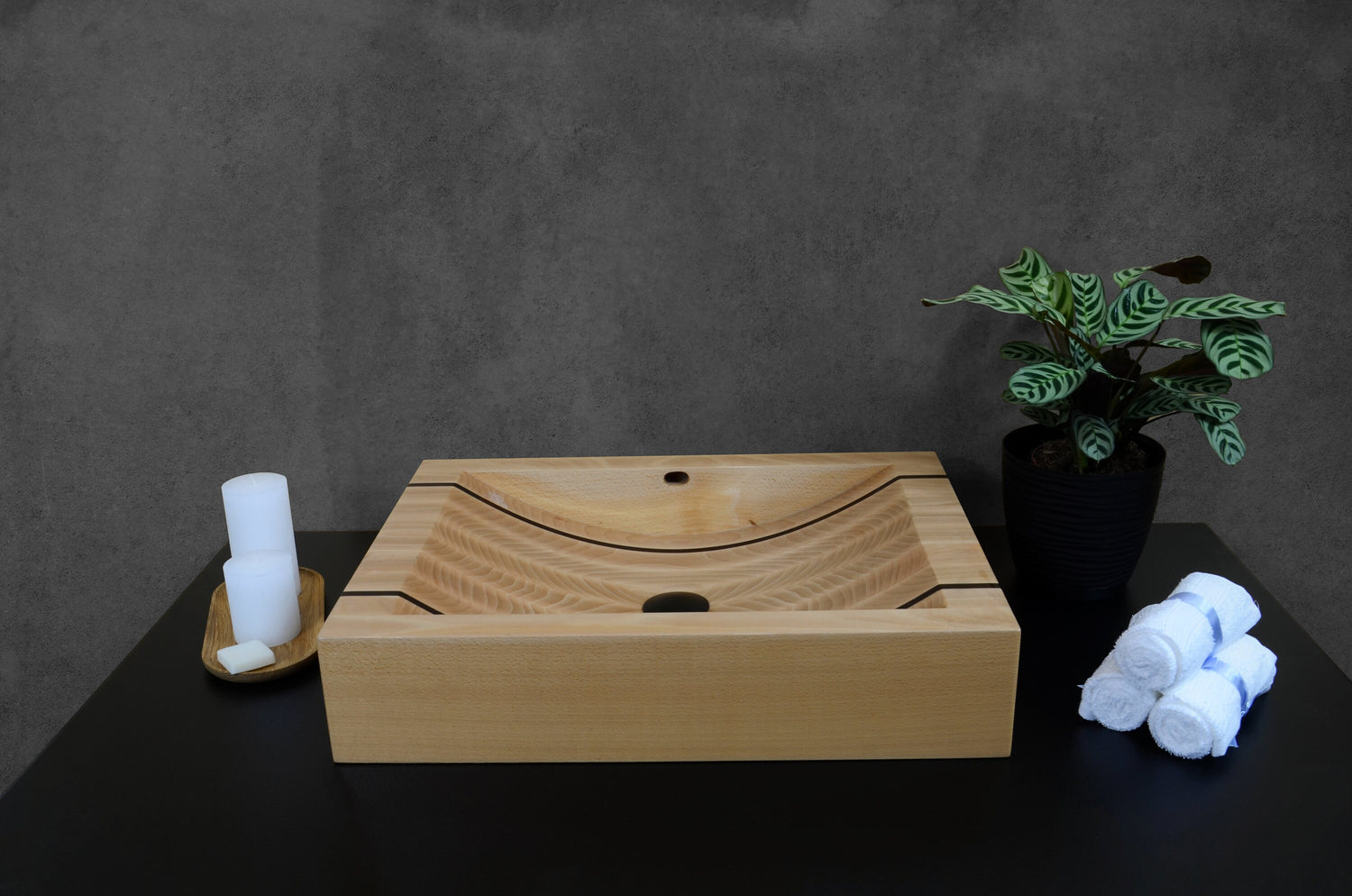 Oakwood bathroom sink with dark wenge wood detailing, artisan-crafted washbasin