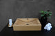 Oakwood bathroom sink with dark wenge wood detailing, artisan-crafted washbasin