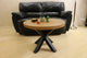 Solid wood round coffee table with black metal spider legs – modern Scandinavian lounge table