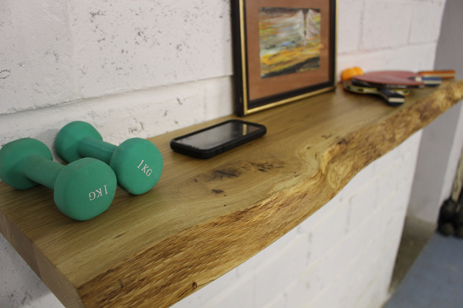 Solid oak floating shelf with natural live edge, handcrafted wooden wall storage for living room or kitchen