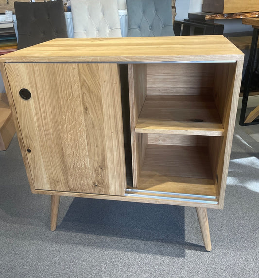 Solid oak sideboard with sliding doors and open shelving, ideal for living room or hallway storage